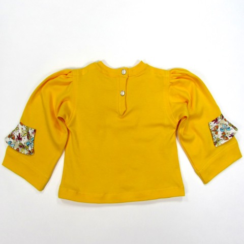 Dos du tee shirt bébé fille jaune en jersey uni et jersey avec noeuds multicolores