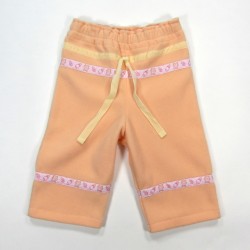 Pantalon bébé en polaire pêche avec ruban velours ivoire et galon brodé sucette et biberon